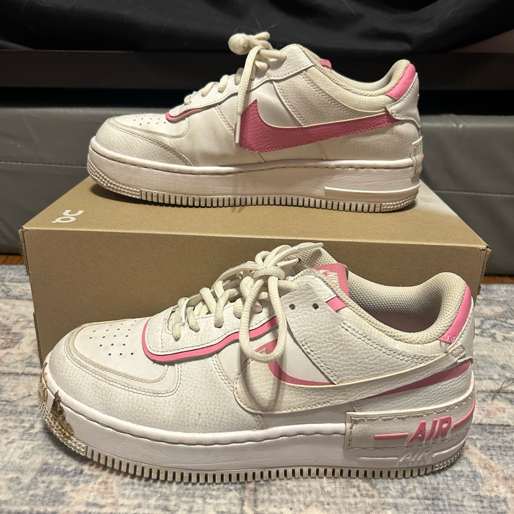 Women’s Pink and White Nike sneakers